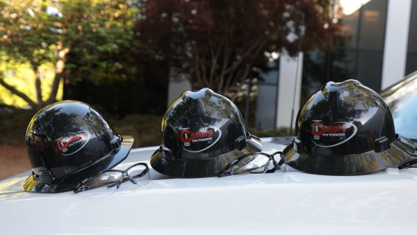Hard Hats on Hood of Truck